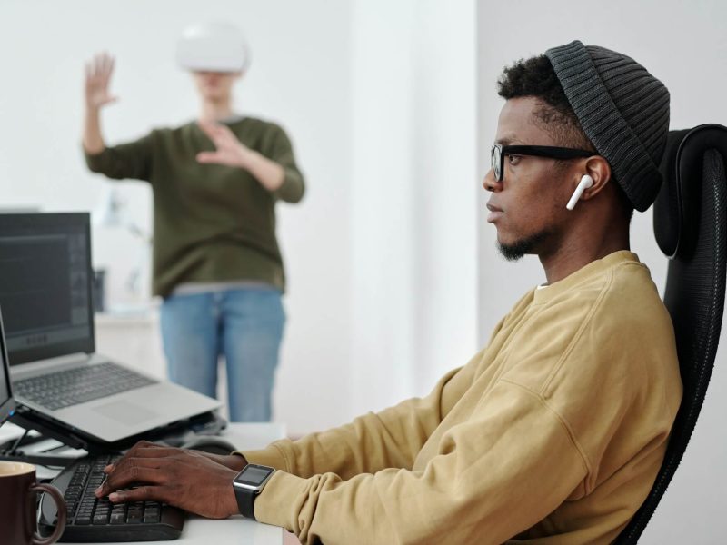 side-view-of-young-businessman-decoding-data-while-looking-at-computer-screen.jpg